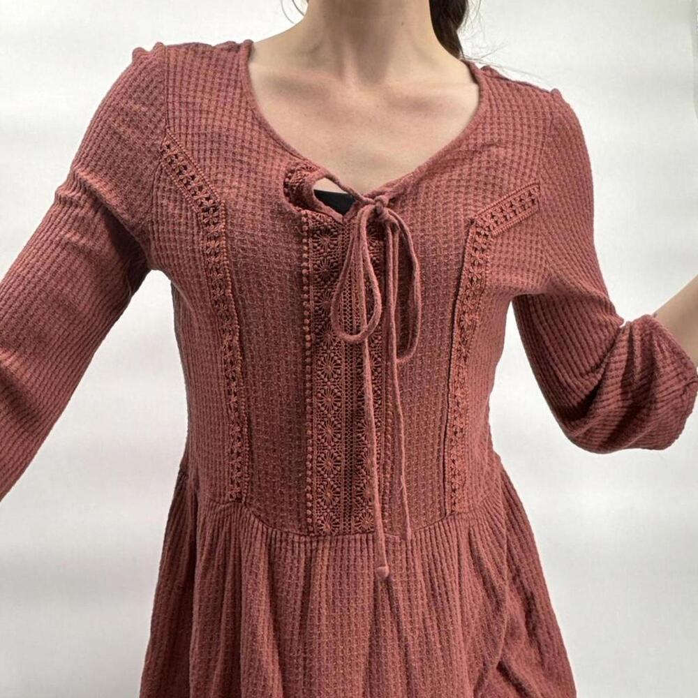 Pink knit babydoll tie front blouse